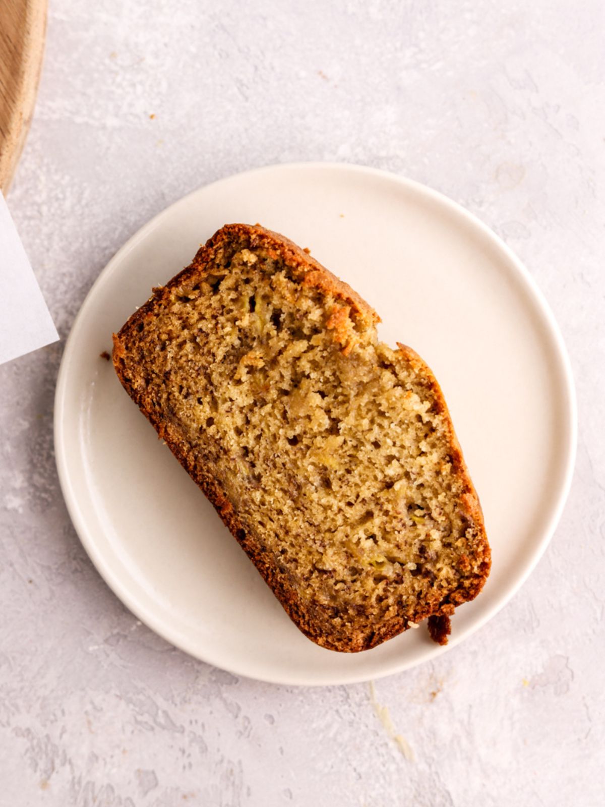 A slice of banana bread on a plate.