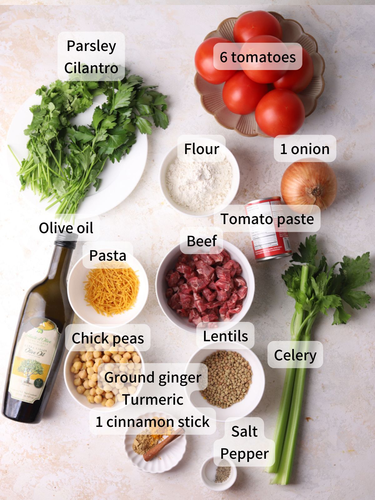 Labeled ingredients needed to make harira soup laid out on a table.