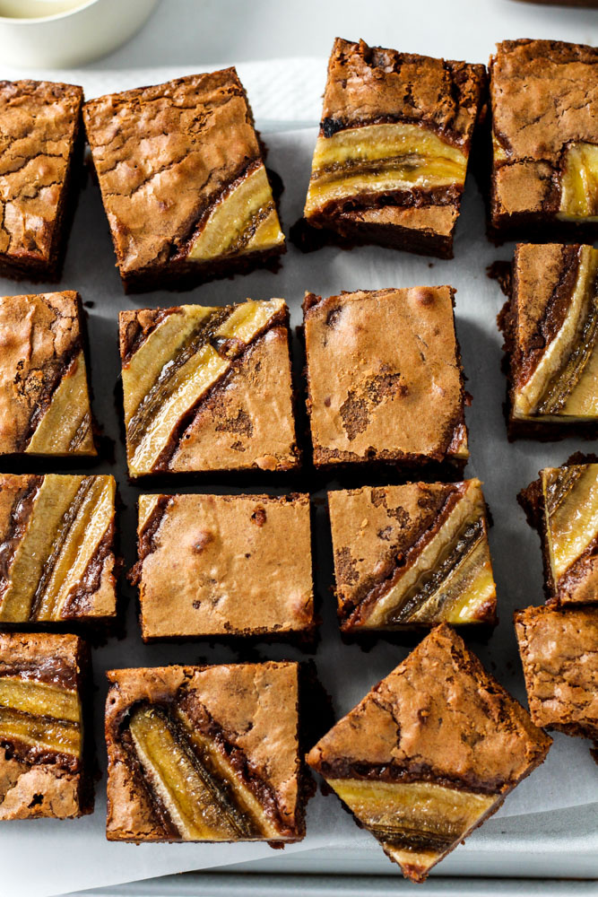 Delicious thick chocolate brownies cut into squares.