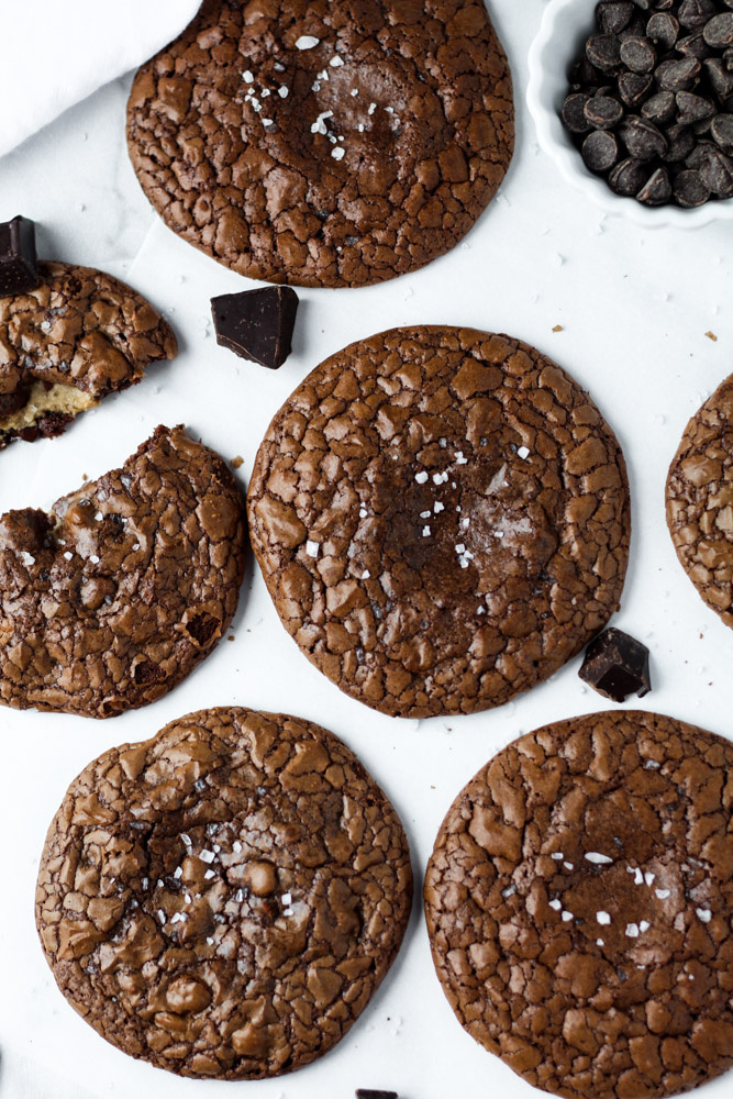 salted chocolate cookies with crackly tops and peanut butter in the middle.