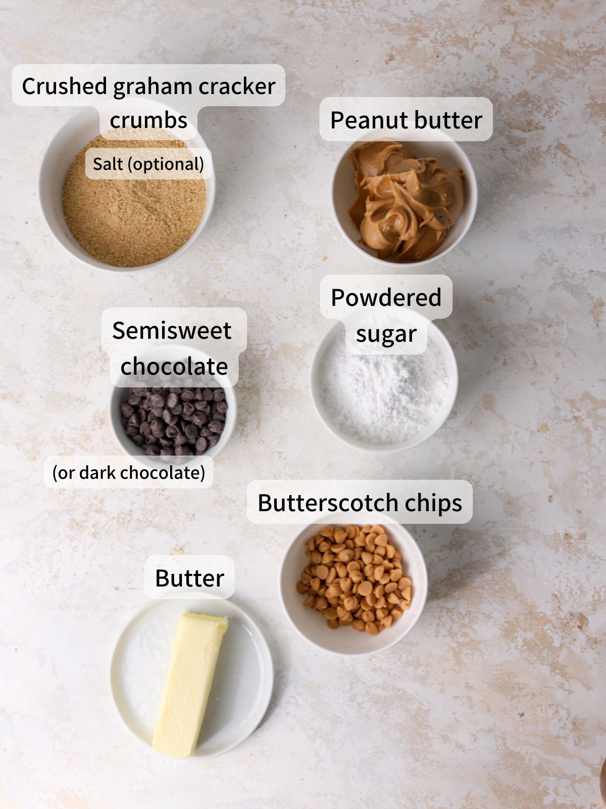 Labeled ingredients needed to make peanut butter bars laid out on a table.