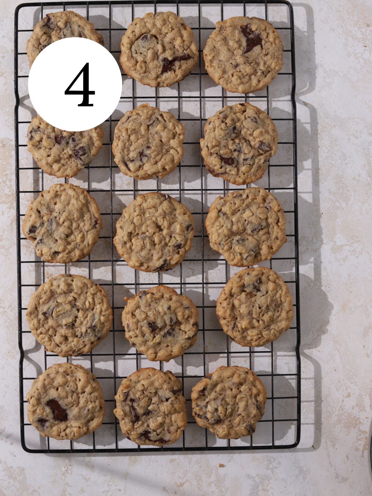 Peanut butter chocolate cookies on a wire cooling rack.
