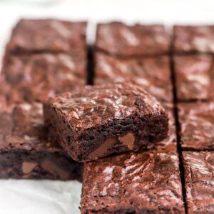 A brownie set on a batch of sliced brownies.