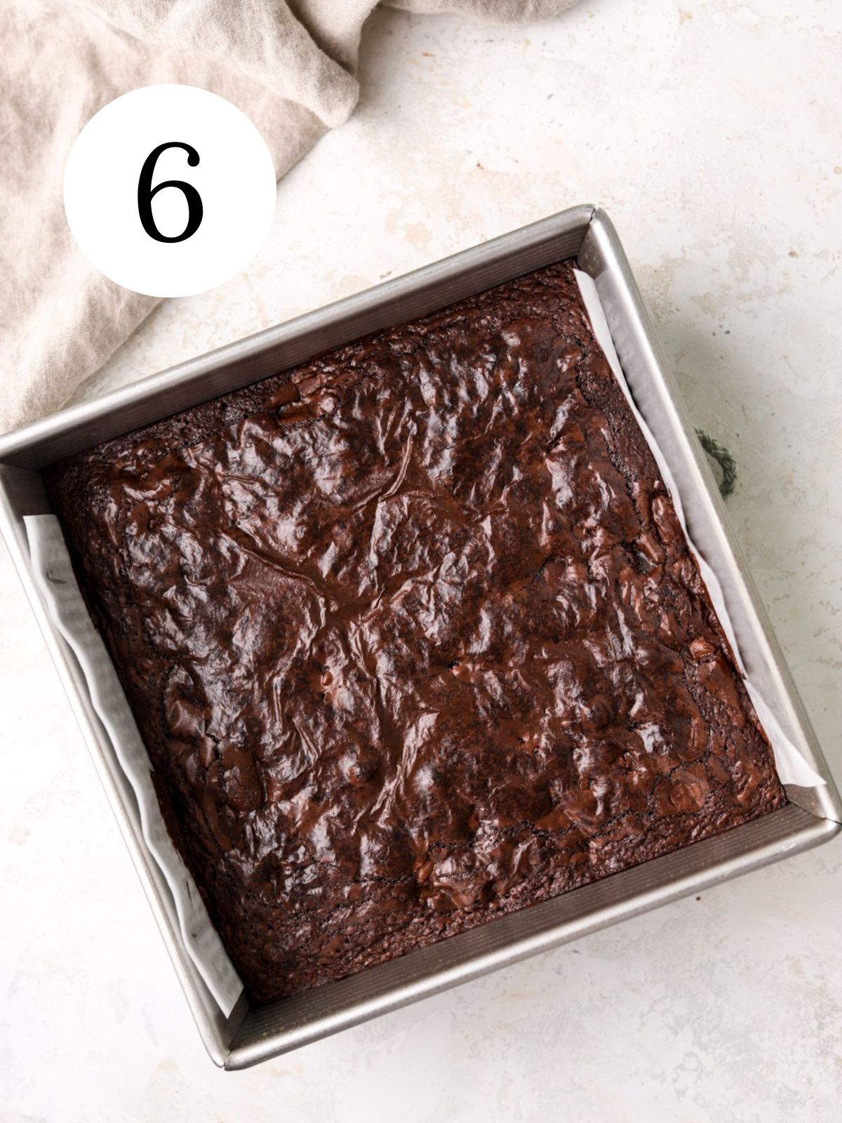Freshly baked brownies in a square pan. 