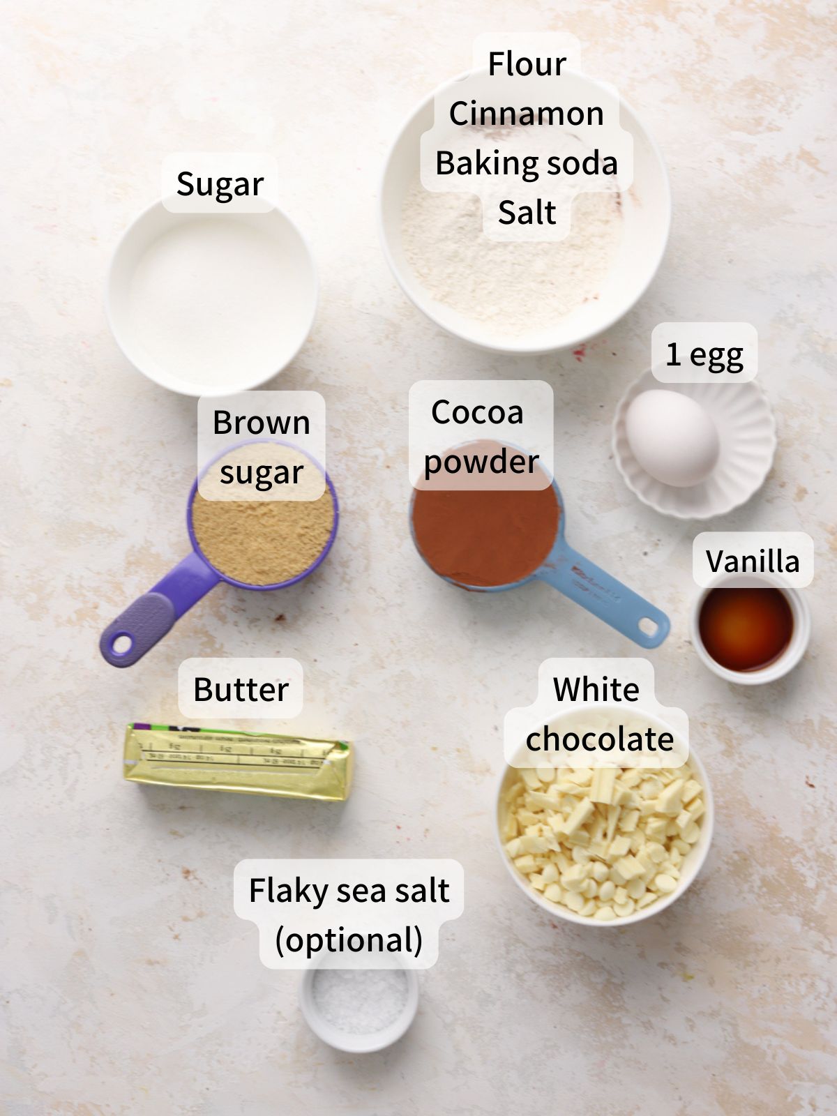 Labeled ingredients for inside out chocolate chip cookies laid out on a table.