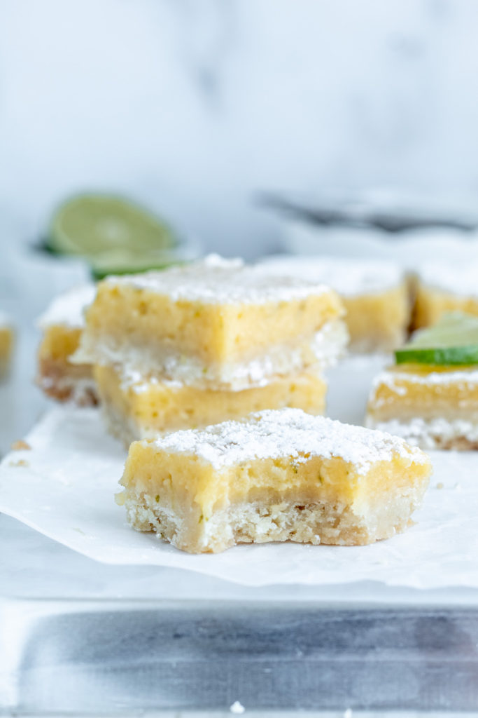 A close up of creamy, tart lime slice with a bite taken out of it! 