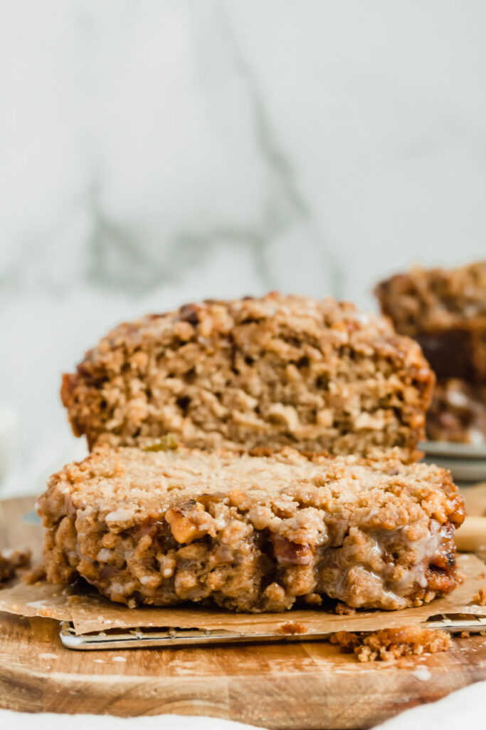 A thick slice of apple bread topped with a delicious maple walnut crumble. 