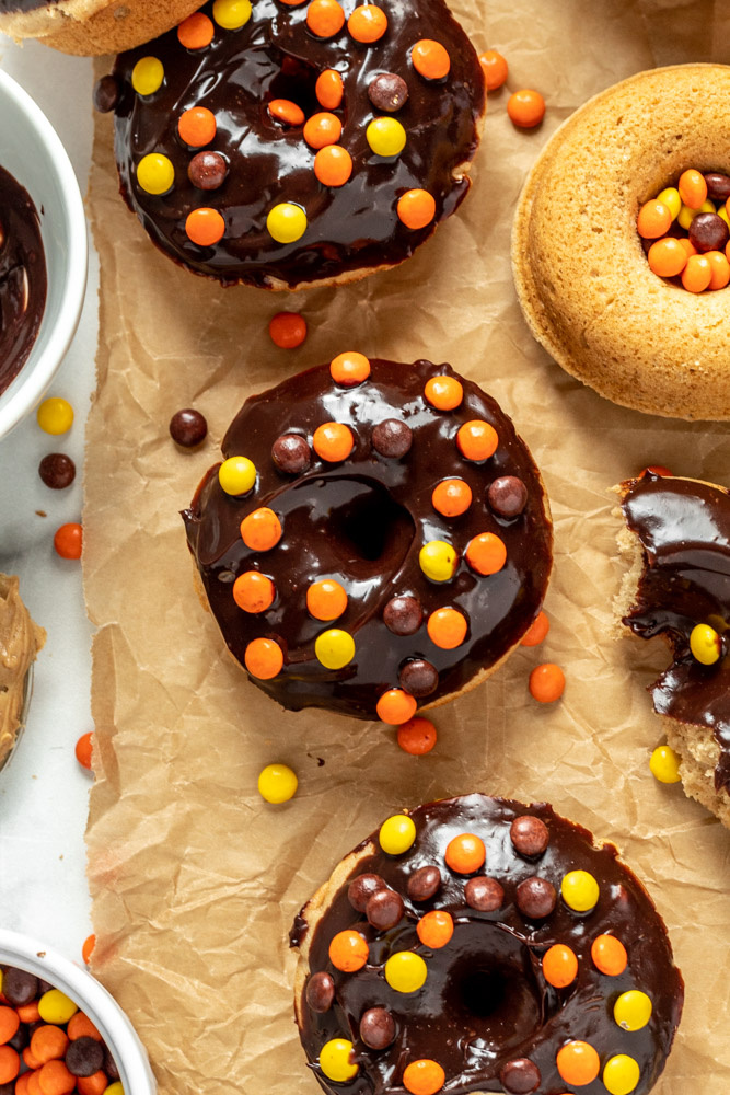 Fluffy peanut butter donuts with chocolate frosting and reese's pieces. 