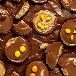 brownies with lots of peanut butter cups decorated with cute monster faces.