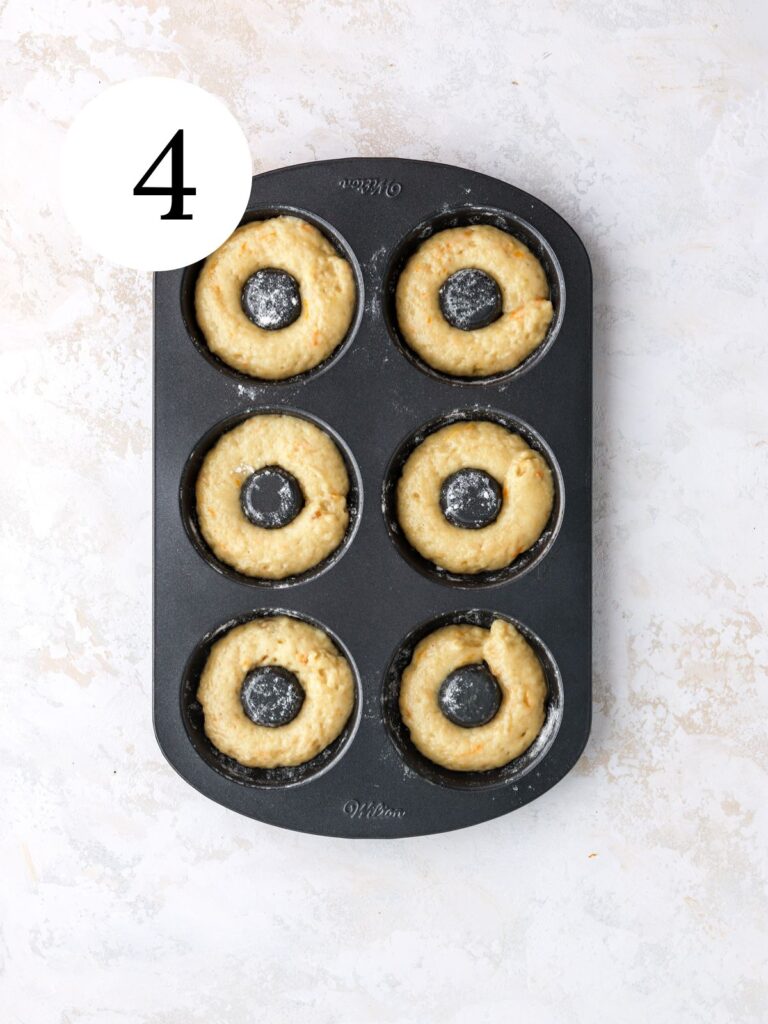 A donut pan filled with donut batter.
