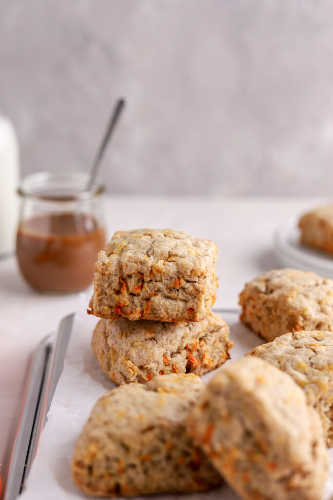 Scones with bits of carrots baked in them and a glass of dulce de leche.