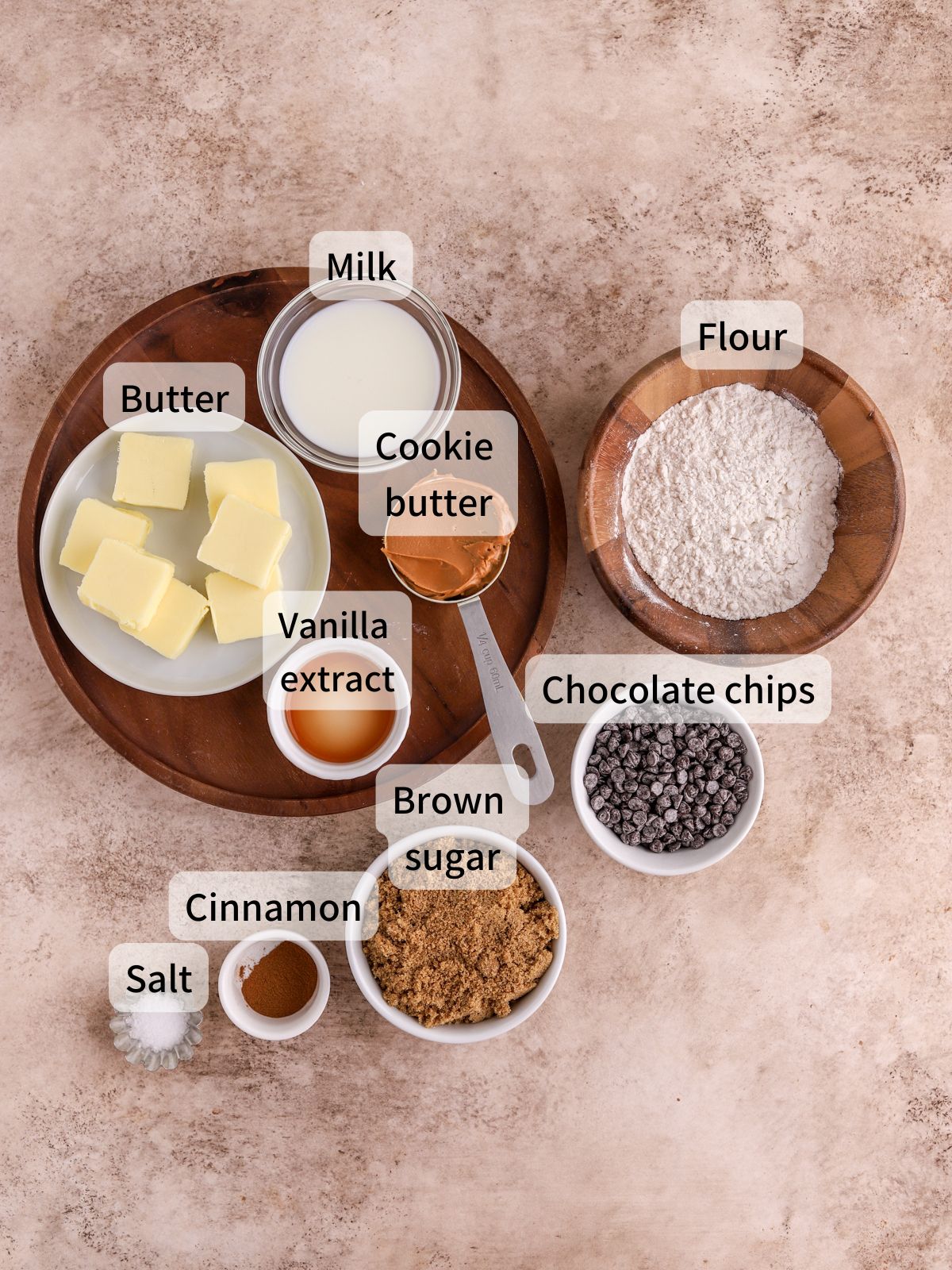 Labeled ingredients needed to make biscoff cookie dough laid out on a table.