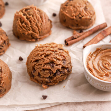 Cookie dough balls and bowls of cookie butter and chocolate chips.