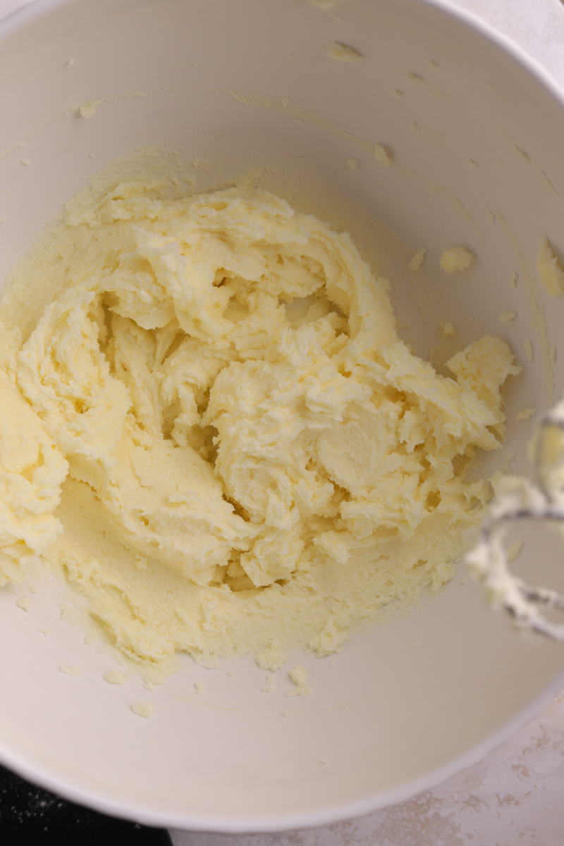 Butter and sugar creamed together in a bowl.