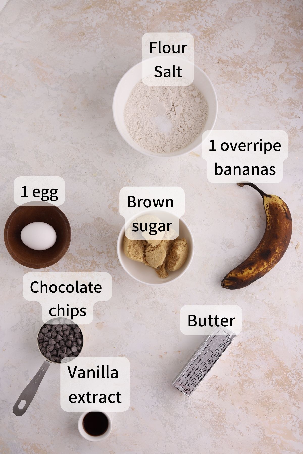 Labeled ingredients needed to make banana blondies laid out on a table. 