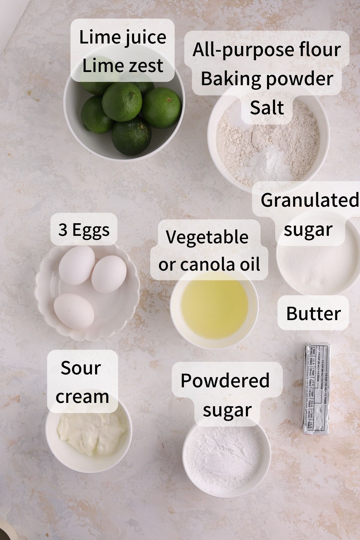 Labeled ingredients needed to make lime drizzle laid out on a table.