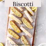 Biscotti with lemon icing with the text Lemon Biscotti on it.