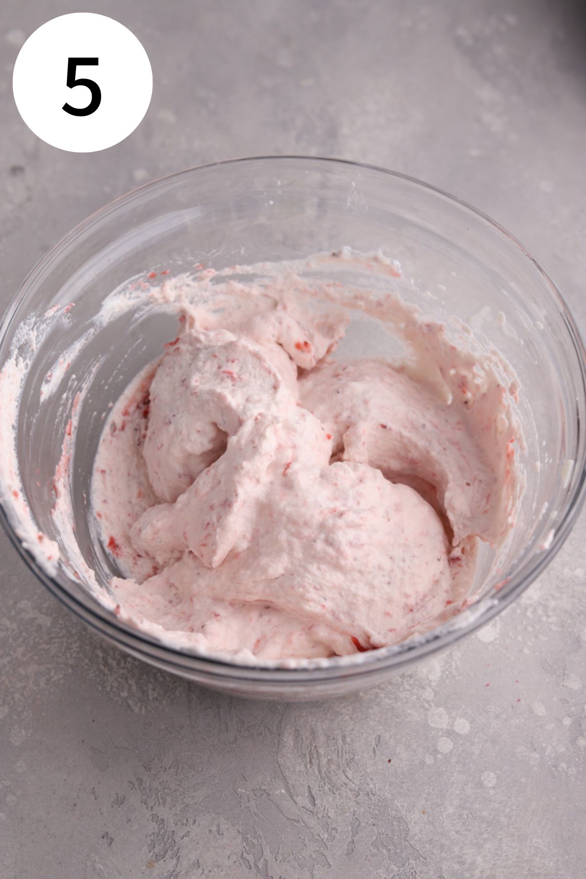 Strawberry mousse in a large glass mixing bowl. 