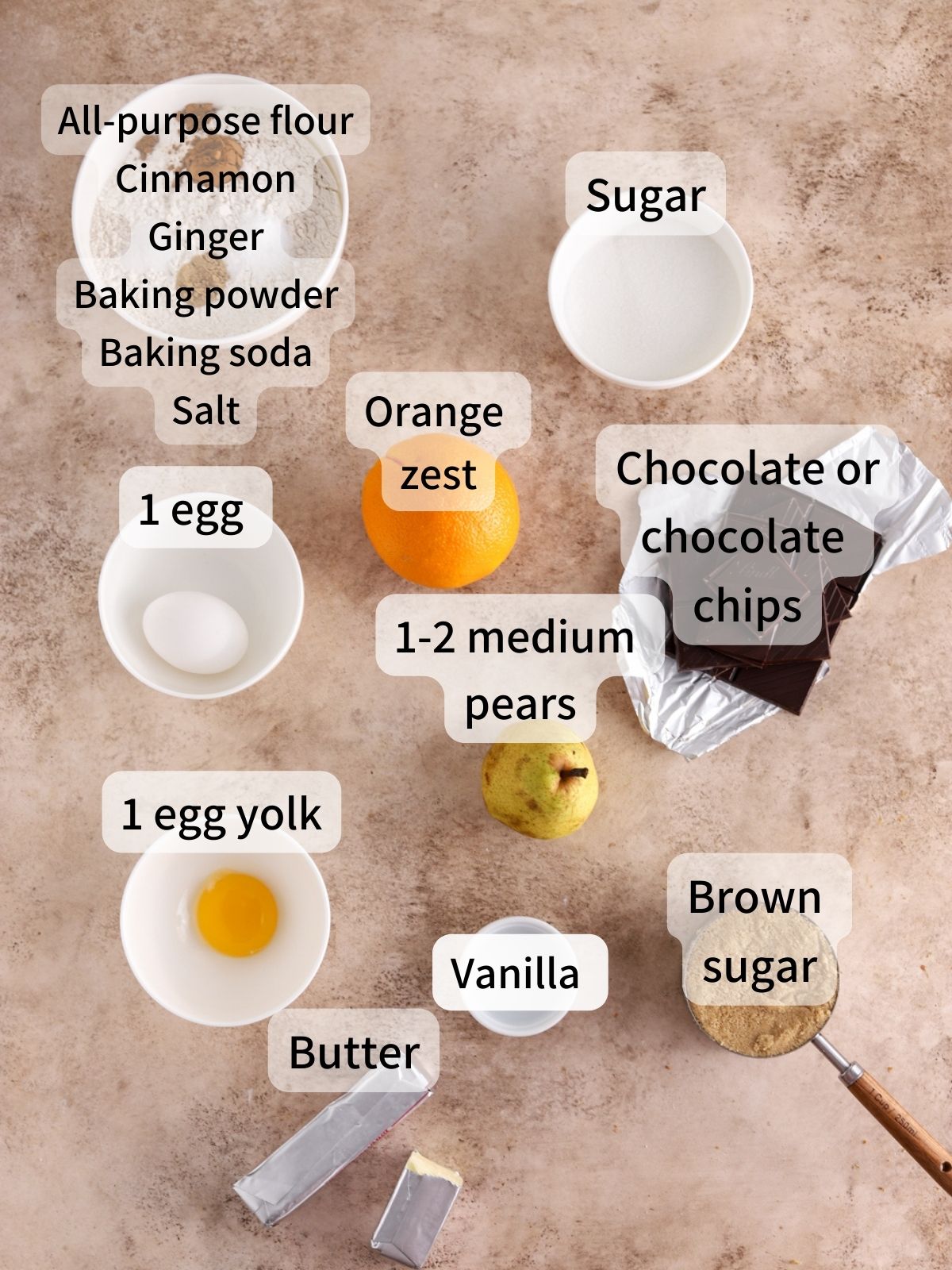 Labeled ingredients needed to make pears laid out on a table.