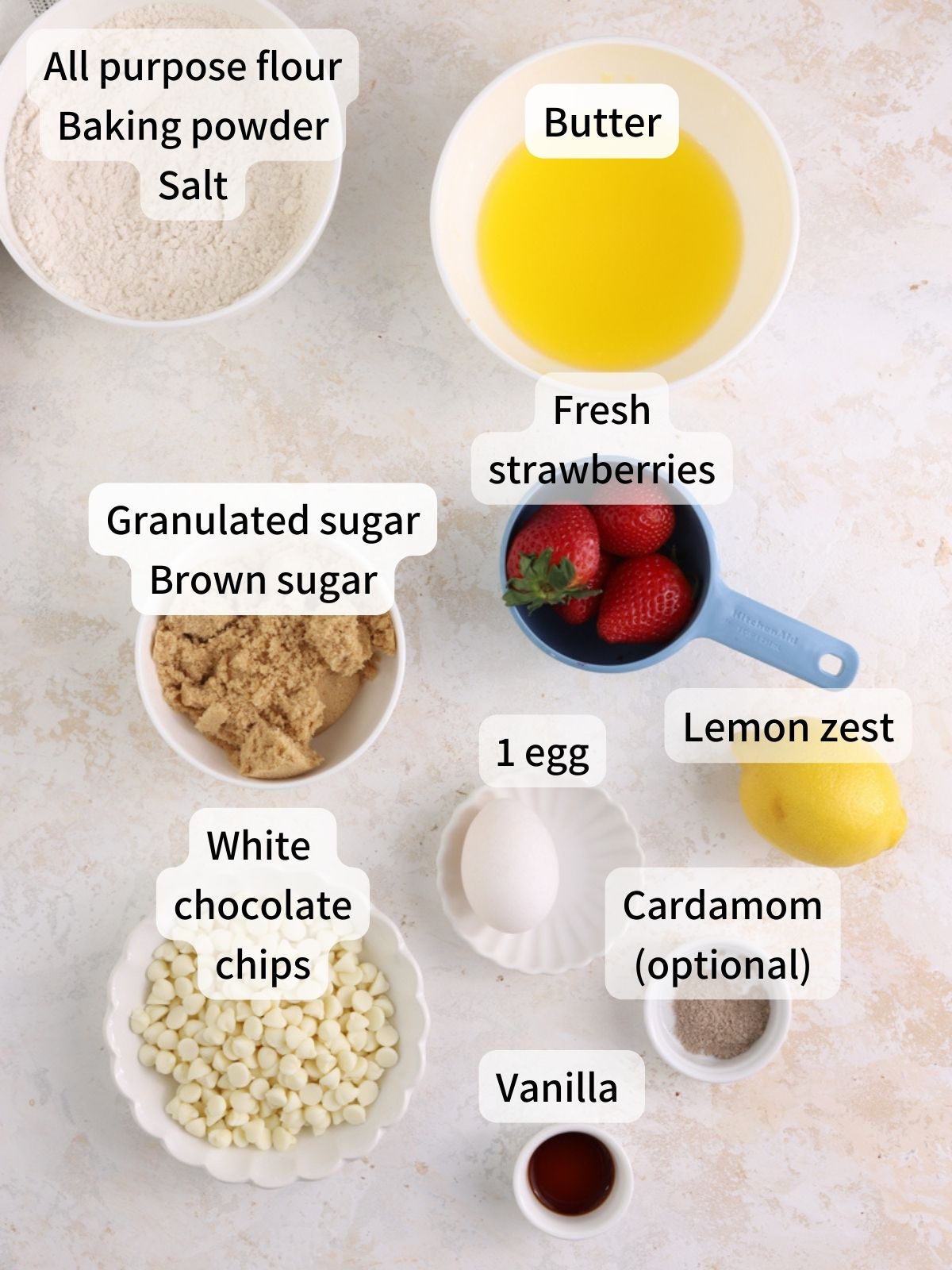 Labeled ingredients needed to make strawberry blondies laid out on a table. 