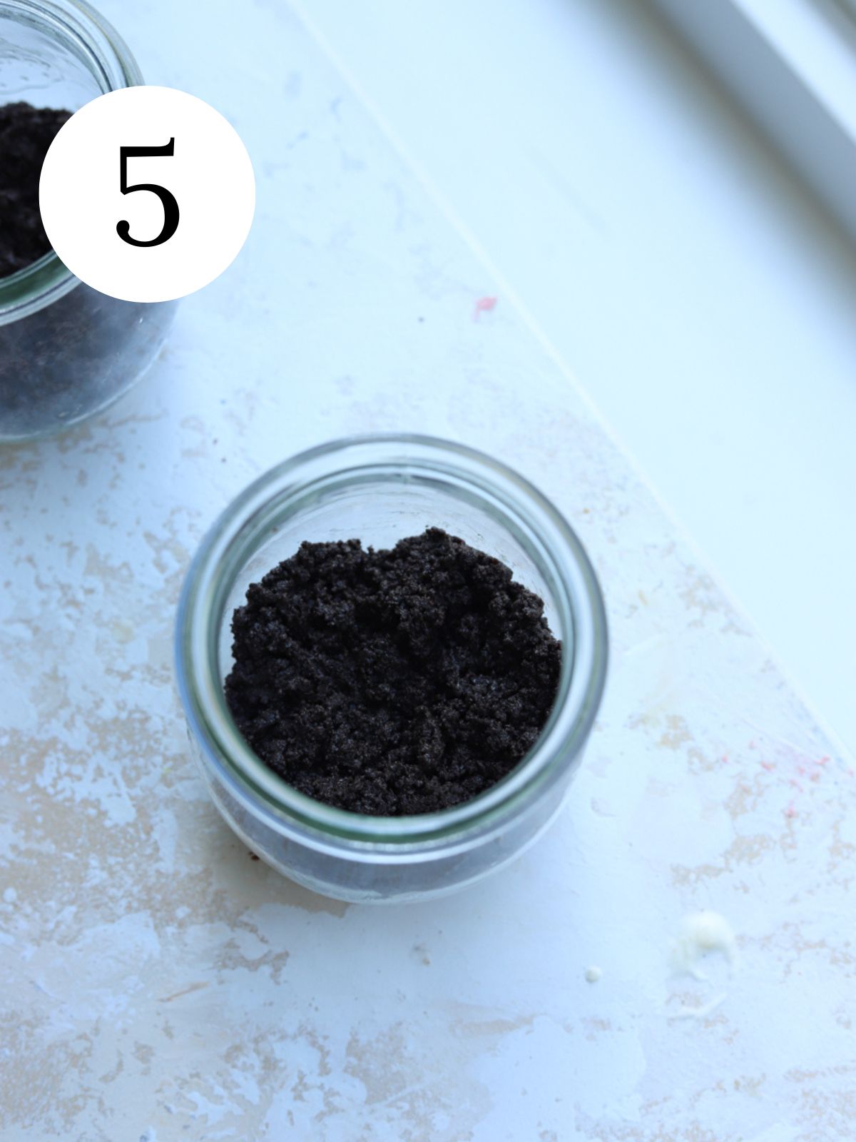 Jars with an Oreo cookie crust on the bottom.