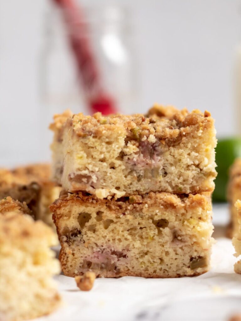 Two pieces of rhubarb cake stacked on top of each other.