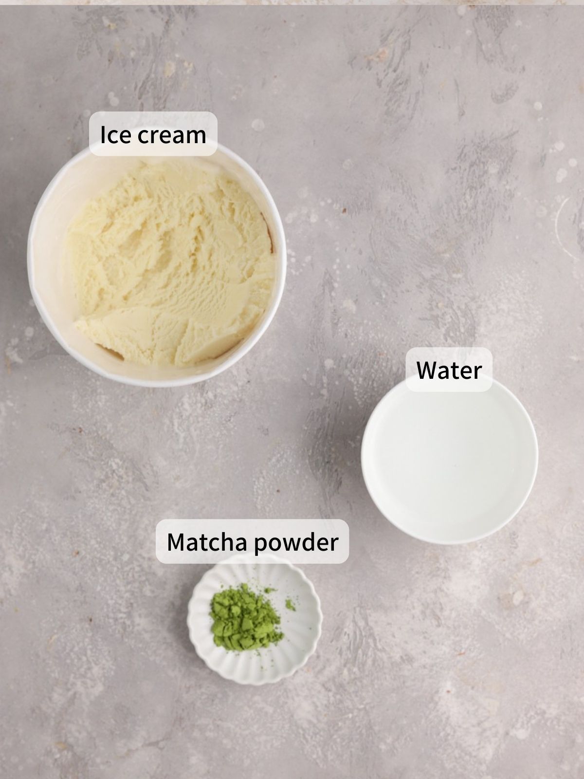 Labeled ingredients needed to make matcha affogato laid out on a table.
