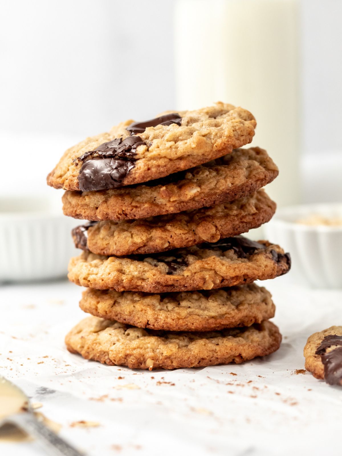 A stack of oatmeal cookies with chocolate.