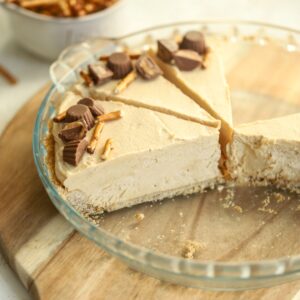 Peanut butter pretzel pie sliced in a pie dish.