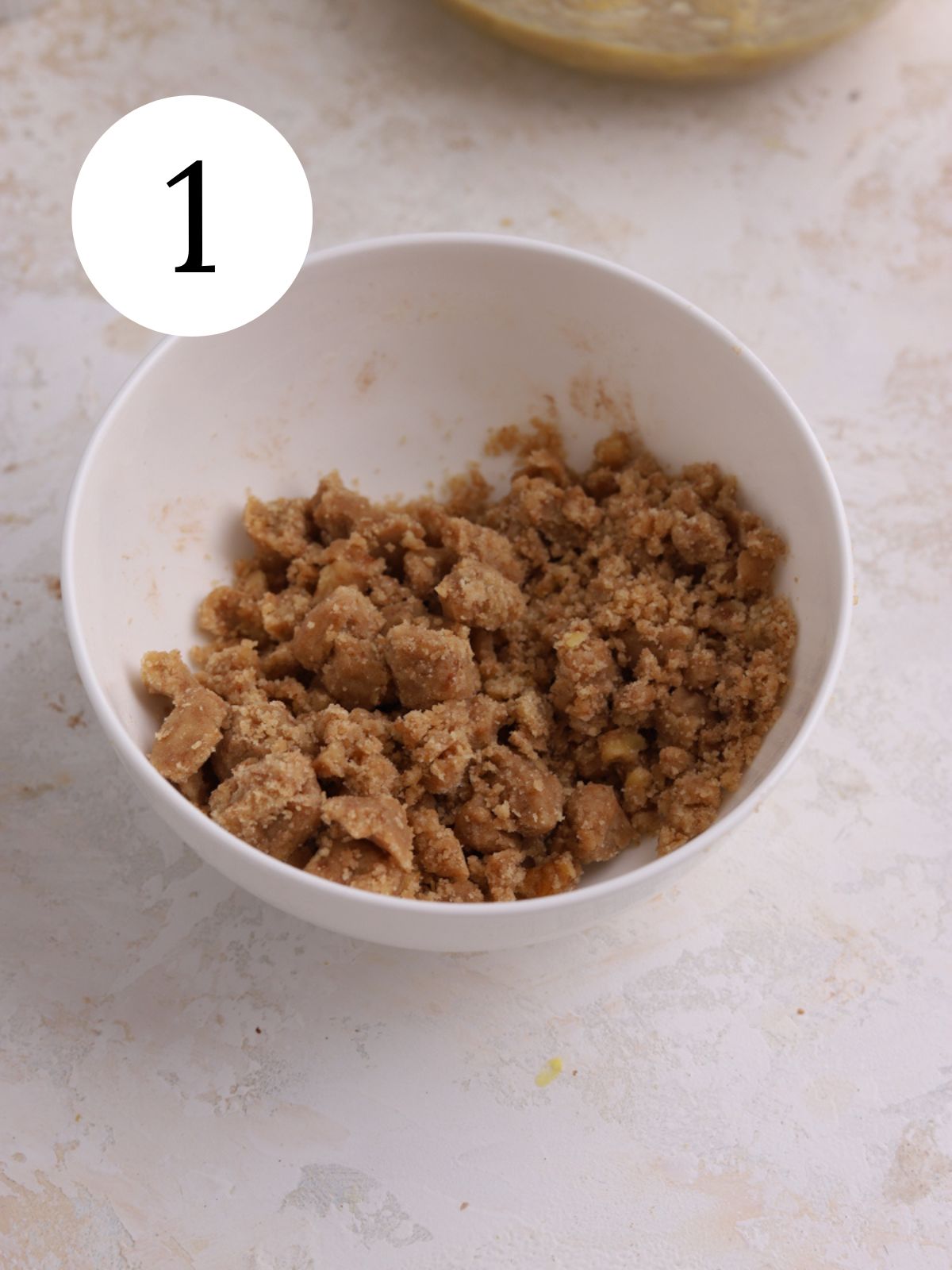 Streusel topping mixed together in a white bowl. 